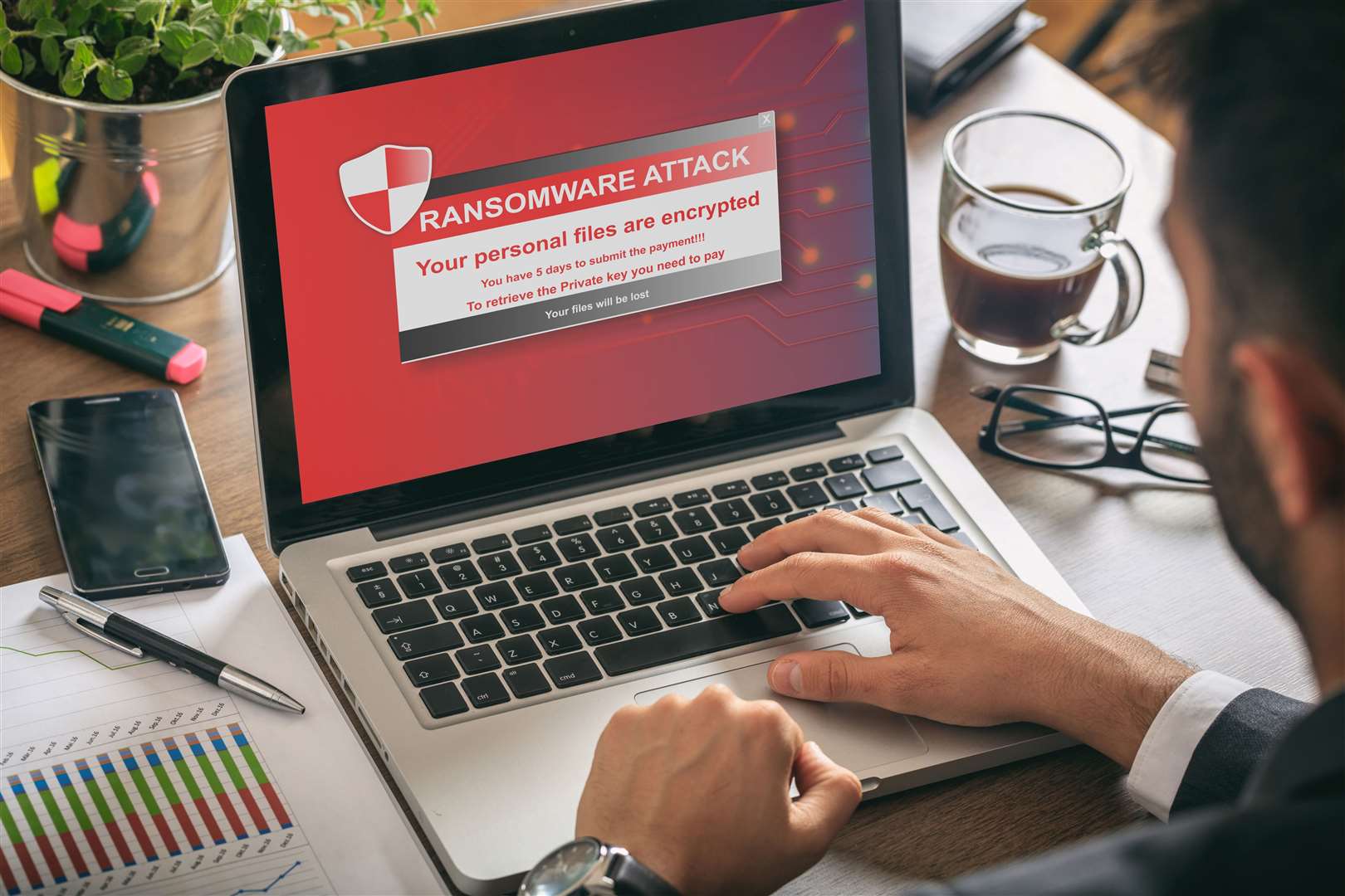 Ransomware alert message on a laptop screen.