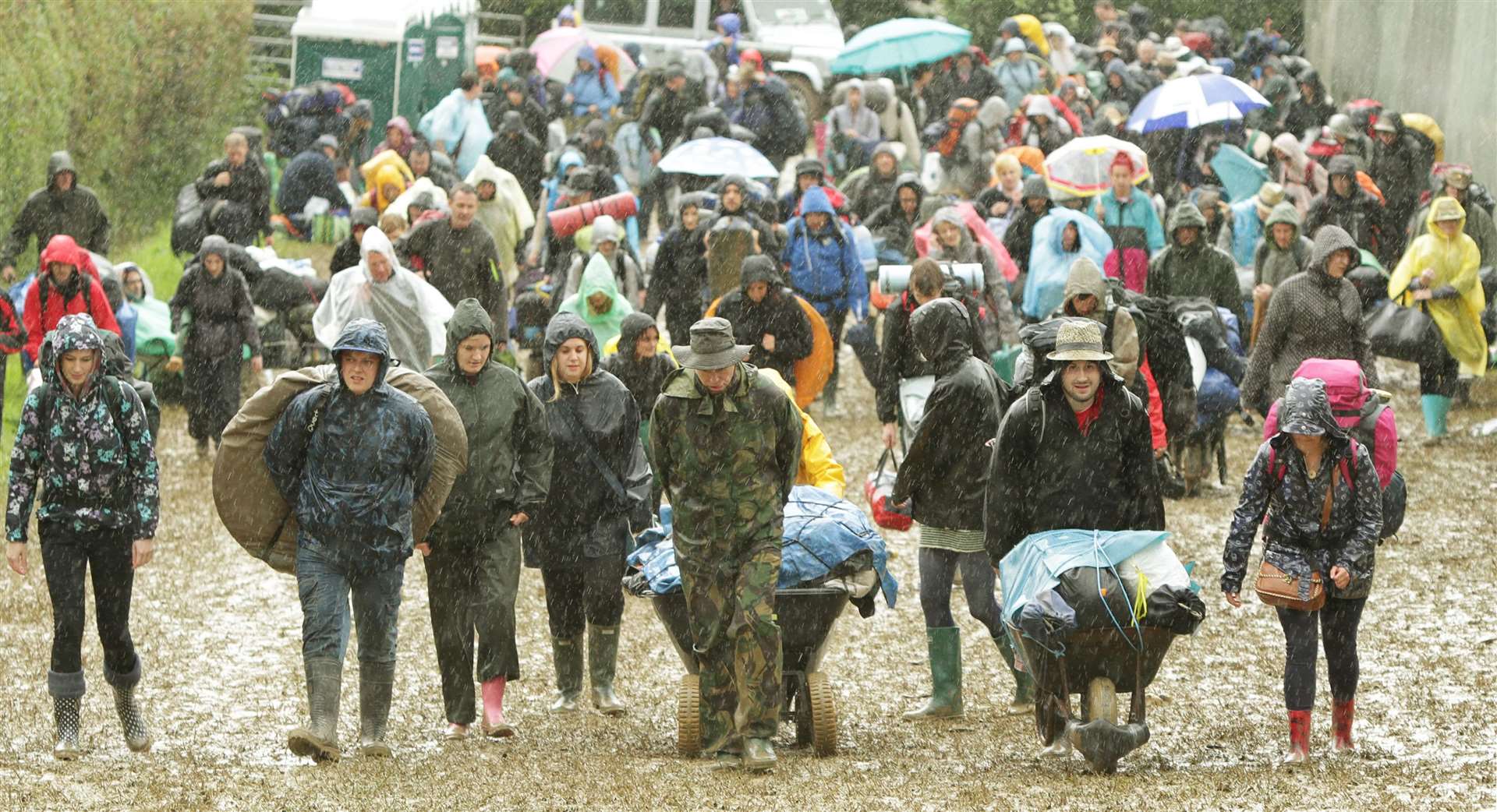 Festival goers arriving at the Glastonbury Festival in 2011 (Yui Mok/PA)