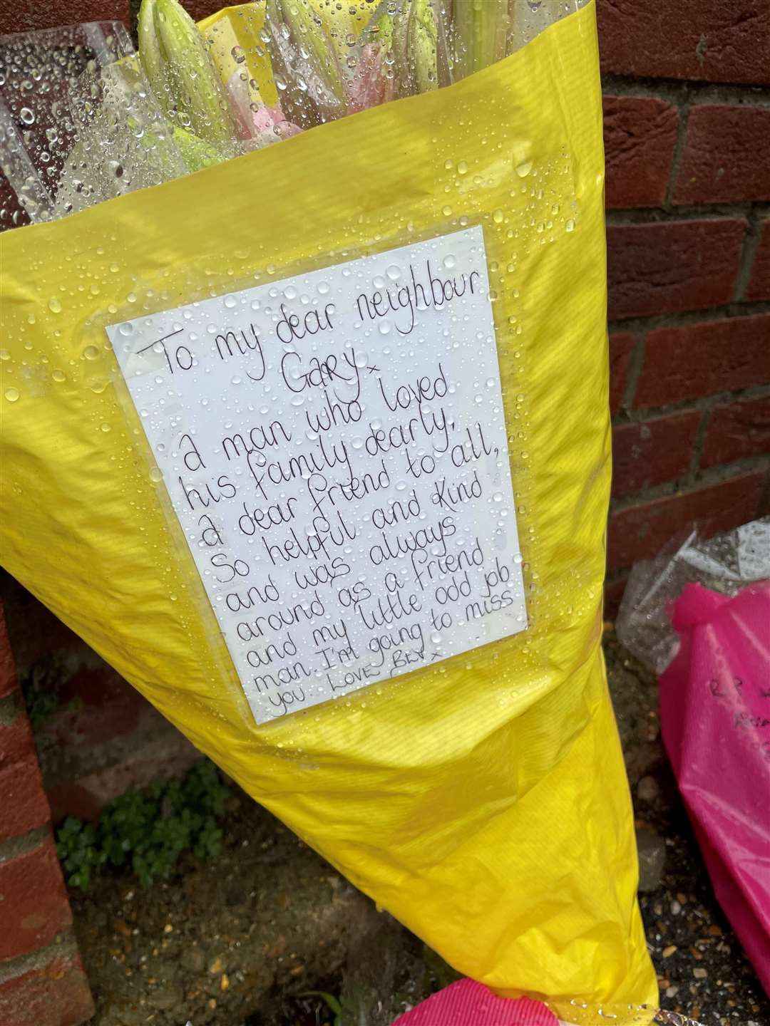 A floral tribute outside the home of Gary Dunmore, 57, who was shot dead in Sutton, Cambridgeshire (PA)
