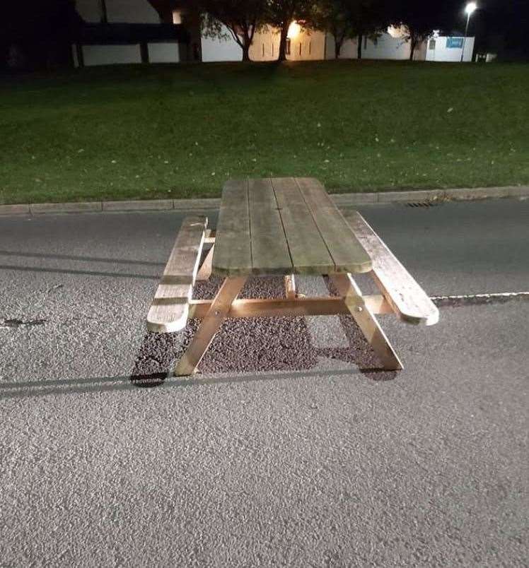 The Facebook photo showing the picnic bench in the middle of Barn Church Road.