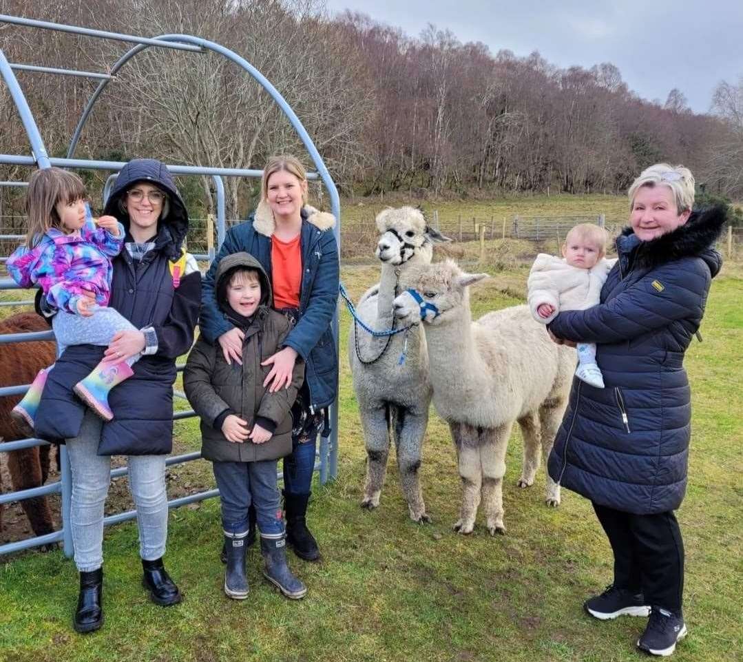 Jenna Christie and family visiting some alpacas.