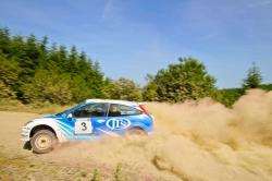 Inverness co-driver Paul Beaton and Euan Thorburn survived the dusty conditions to win in Wales