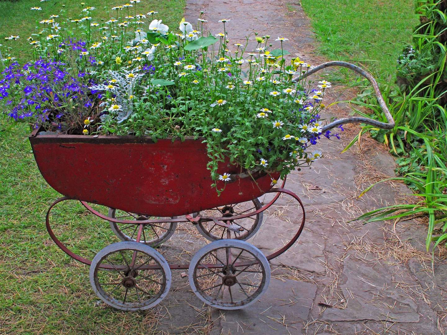 A flower container made from a recycled pram. Picture: Alamy/PA.