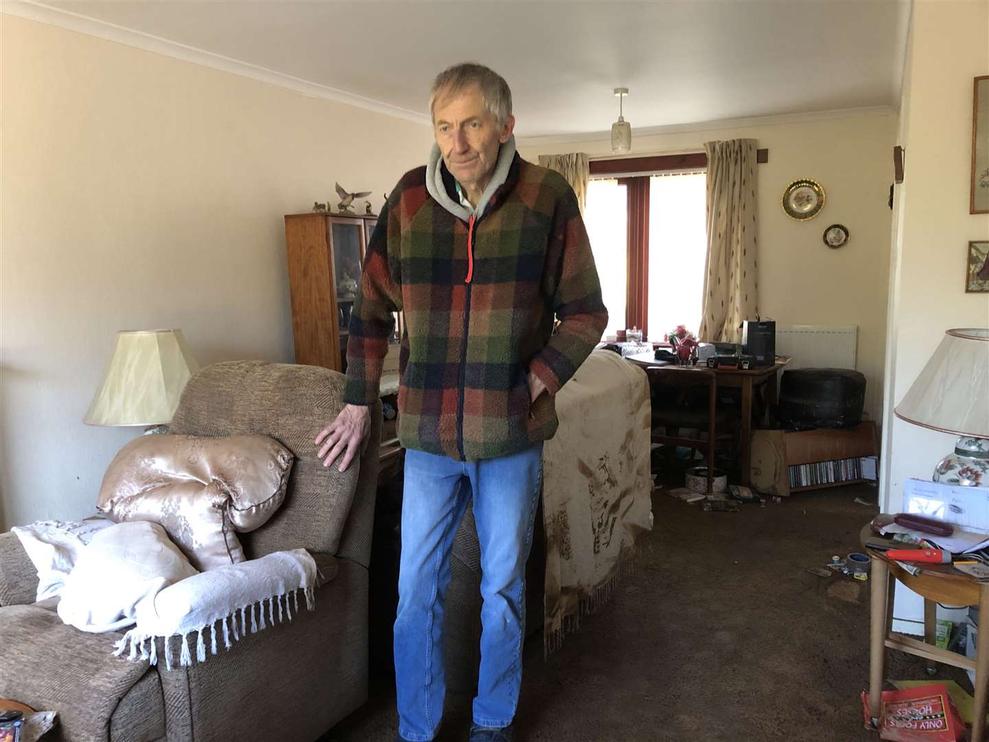 Brian Petrie stands inside his home in River Street, Brechin, which was flooded by Storm Babet (Neil Pooran/PA)