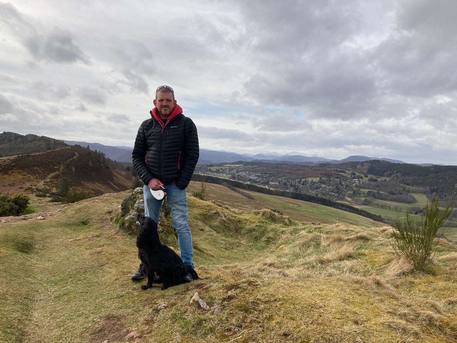 Neil Lancaster with his dog Peggy on the Cat's Back near Strathpeffer.