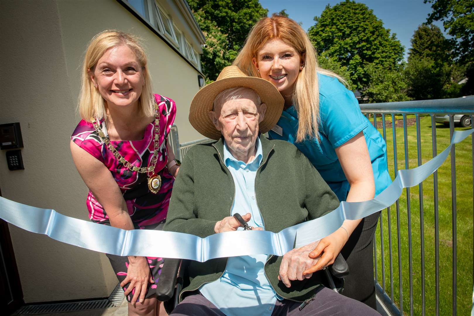 Opening the new extension are Dept Provost Jackie Hendry, Alex Sinclair (the oldest resident) and Sophie Stewart (the youngest member of the care team ). .Picture: Callum Mackay..
