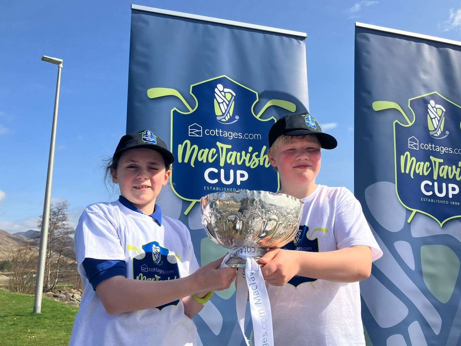 Maura and Kenny from Lochcarron Primary School with the famous cottages.com MacTavish Cup.