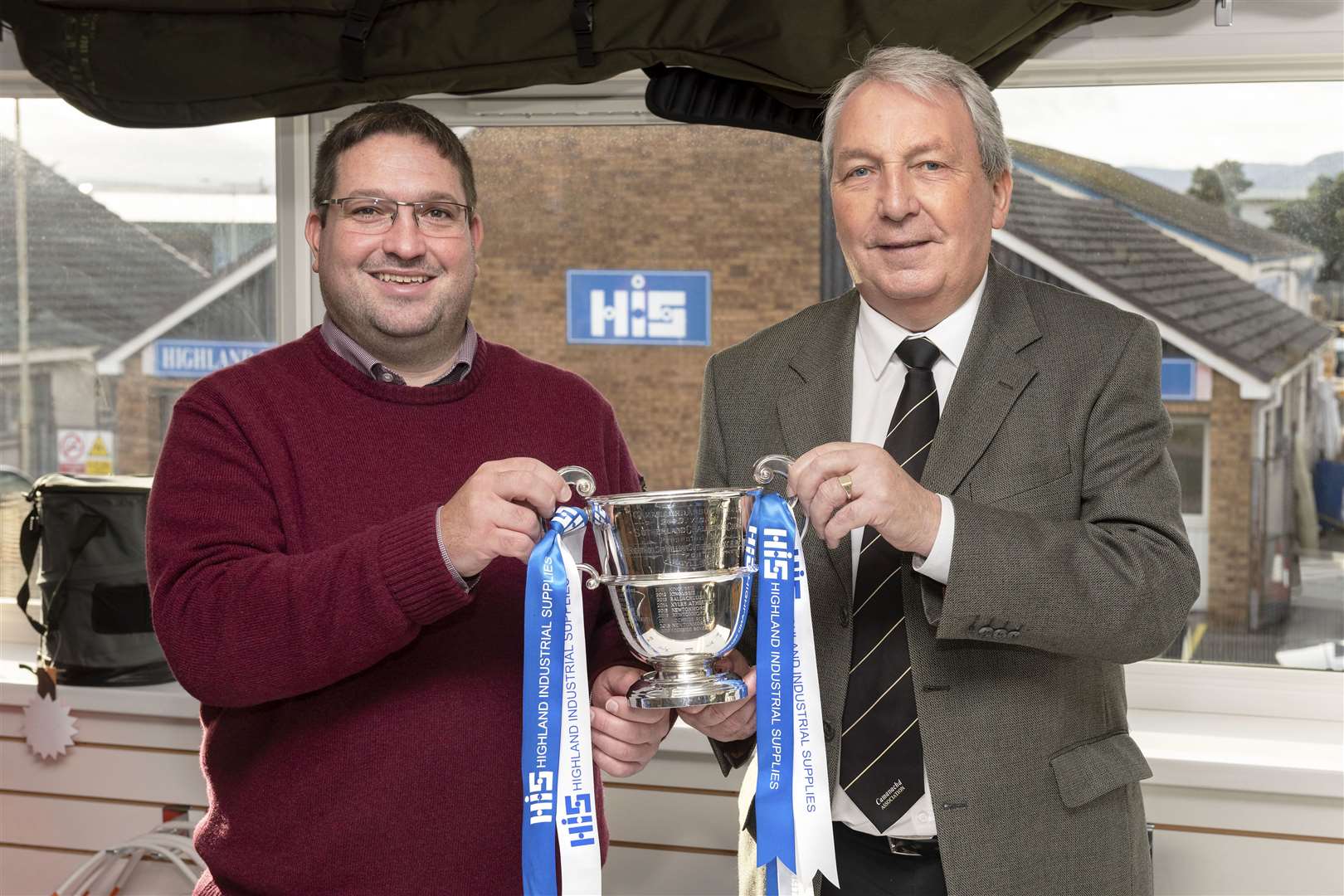 Garry Mackintosh of tournament sponosors Highland Industrial Supplies with Camanachd Association president Keith Loades. Picture: Neil G Paterson