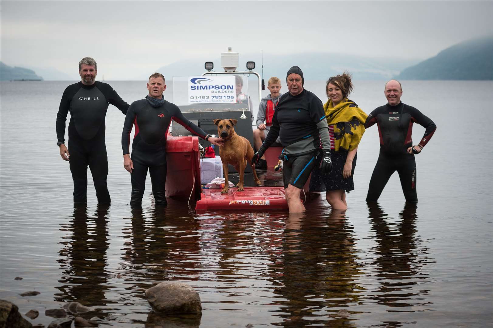A small team from Simpsons Builders Ltd, Beauly across Loch Ness to Dores..(back left to right) support boat crew David and Abraham Mitchell, (front, left to right) Andrew Philips Construction Manager, Gordon Simpson Director, Soolie the dog, Alistair MacGregor, Aileen Anne MacGregor and Mark McCann Quantity Surveyor...Picture: Callum Mackay..