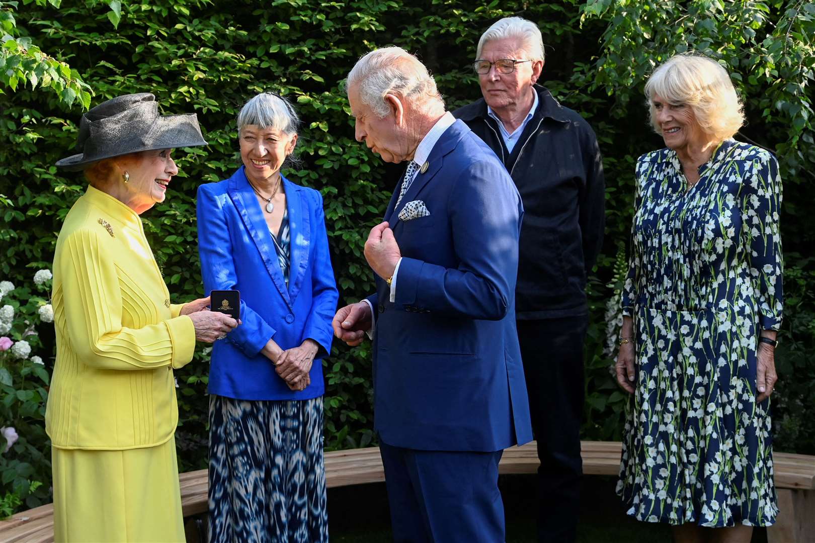 The King and Queen speak to Baroness Janet Fookes, Piet Oudolf and Judy Ling Wong after awarding them the Elizabeth Medal of Honour in the Royal Horticultural Society Garden of Royal Reflection and Celebration during a visit to the RHS Chelsea Flower (Toby Melville/PA)