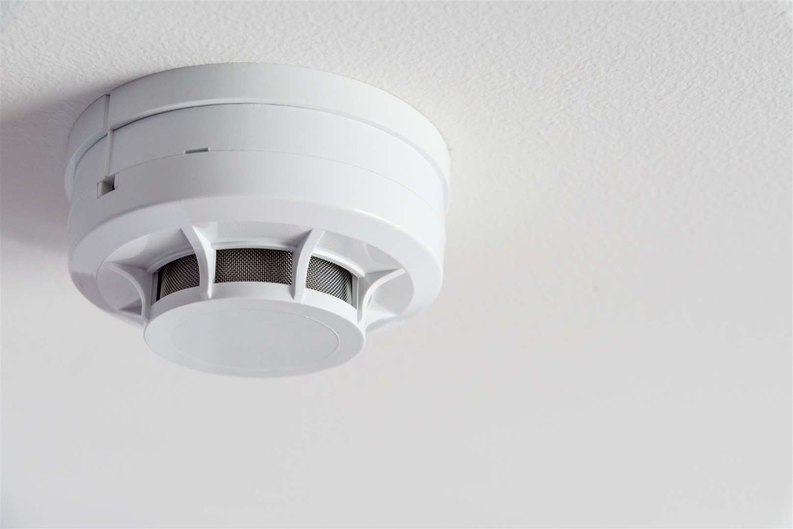 Smoke detector on a ceiling.