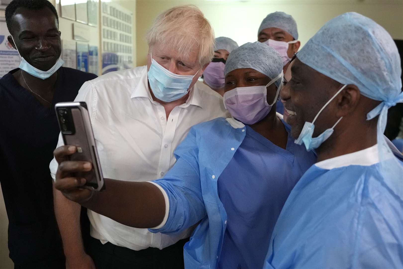 Prime Minister Boris Johnson posed for photographs as he met members of staff at the South West London Elective Orthopaedic Centre on Friday (Kirsty Wigglesworth/PA)