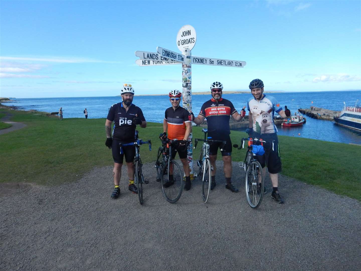 John (right) at John O'Groats during his North Coast 500 cycle tour.