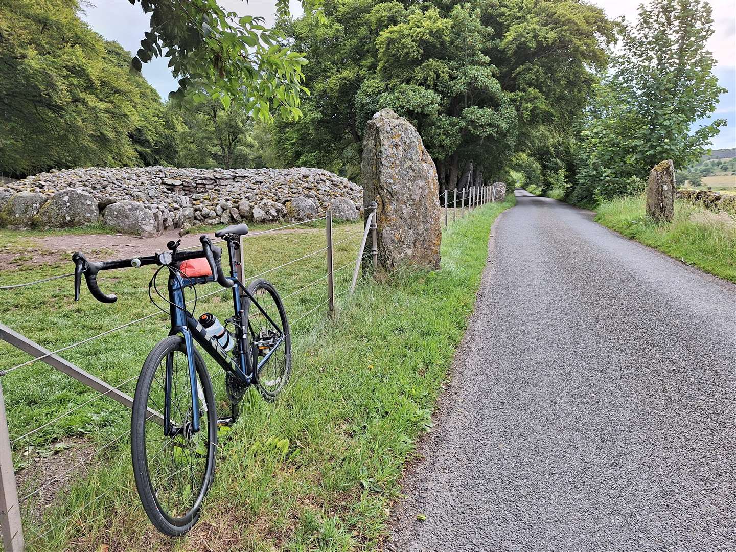 The minor road at the Clava Cairns passes between the standing stones.