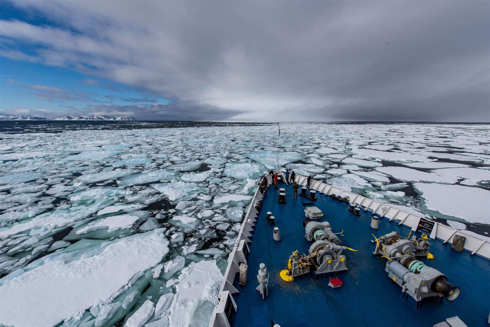 A ship breaks through ice in Svalbard. Picture: PA Photo/Renato Granieri