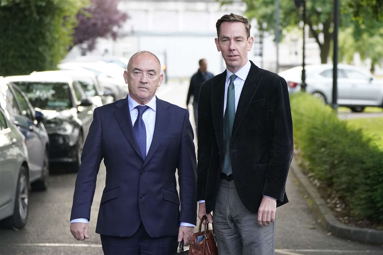 Ryan Tubridy (right) with his agent Noel Kelly leaving Leinster House in Dublin, where they gave evidence before two committees (Niall Carson/PA).