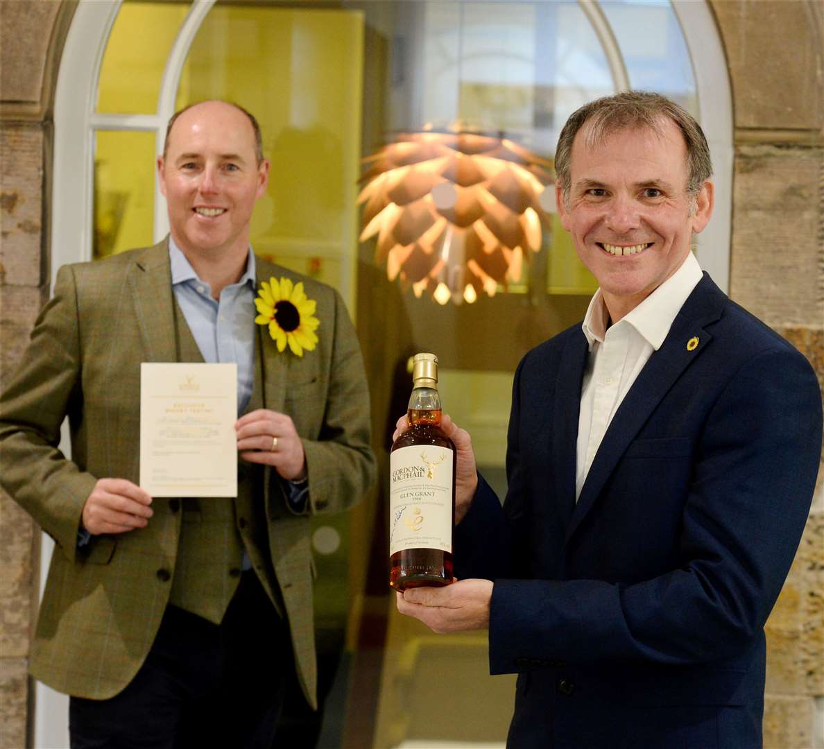 Andrew Leaver, head of fundraising at Highland Hospice, right, with Stephen Rankin of Gordon and MacPhail who has donated a bottle of Glen Grant 1966 and an exclusive whisky trail for six people to help raise funds for the charity.