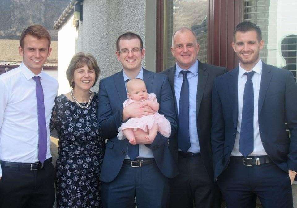 Family picture. From left to right, Martin (son), Susan (wife), Gavin (son) who is holding Aria (eldest grandchild), Malcolm, David (son).