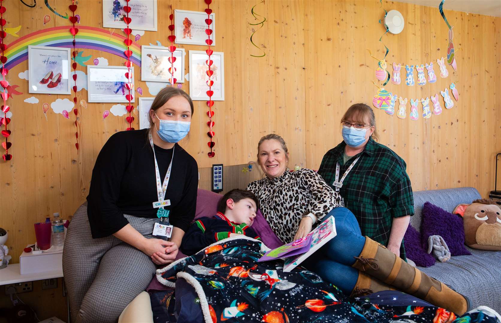 CHAS at Home nurses Chloe Dixon, left and Mairi Stirling, right, with Reece and mum Donna.