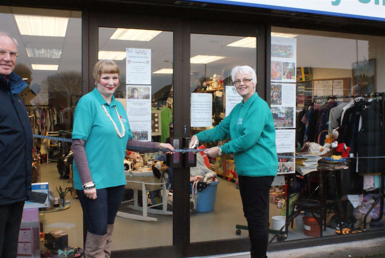 Maureen Quinn (right) cuts the ribbon on the new charity shop, with Culloden manager Evie Henry on hand to help.