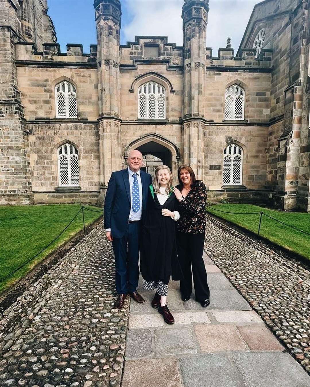 Rachel with her parents James and Ruth on Graduation day.