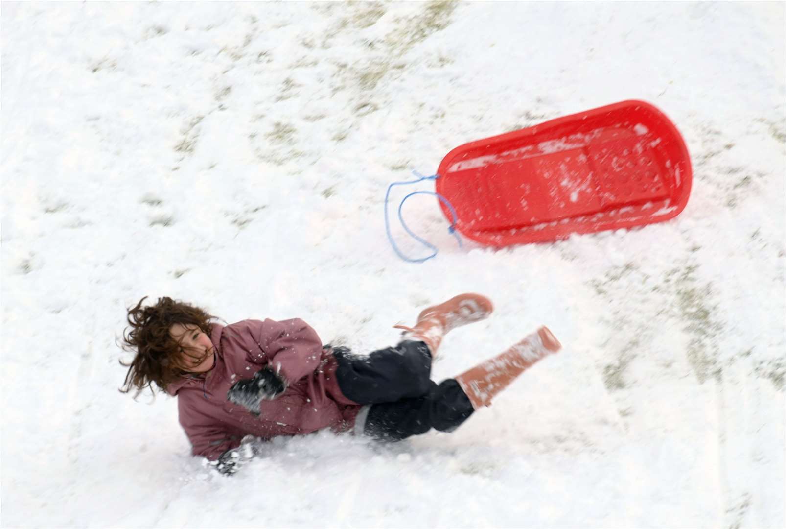 Falling off the sledge. Picture: James Mackenzie.