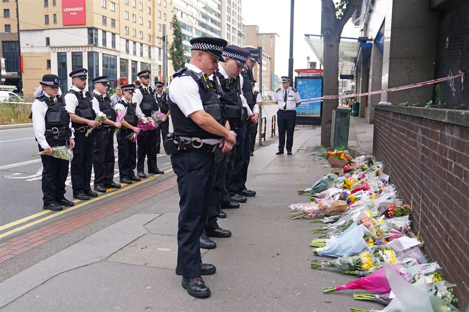 Police officers were among those laying flowers (James Manning/PA)