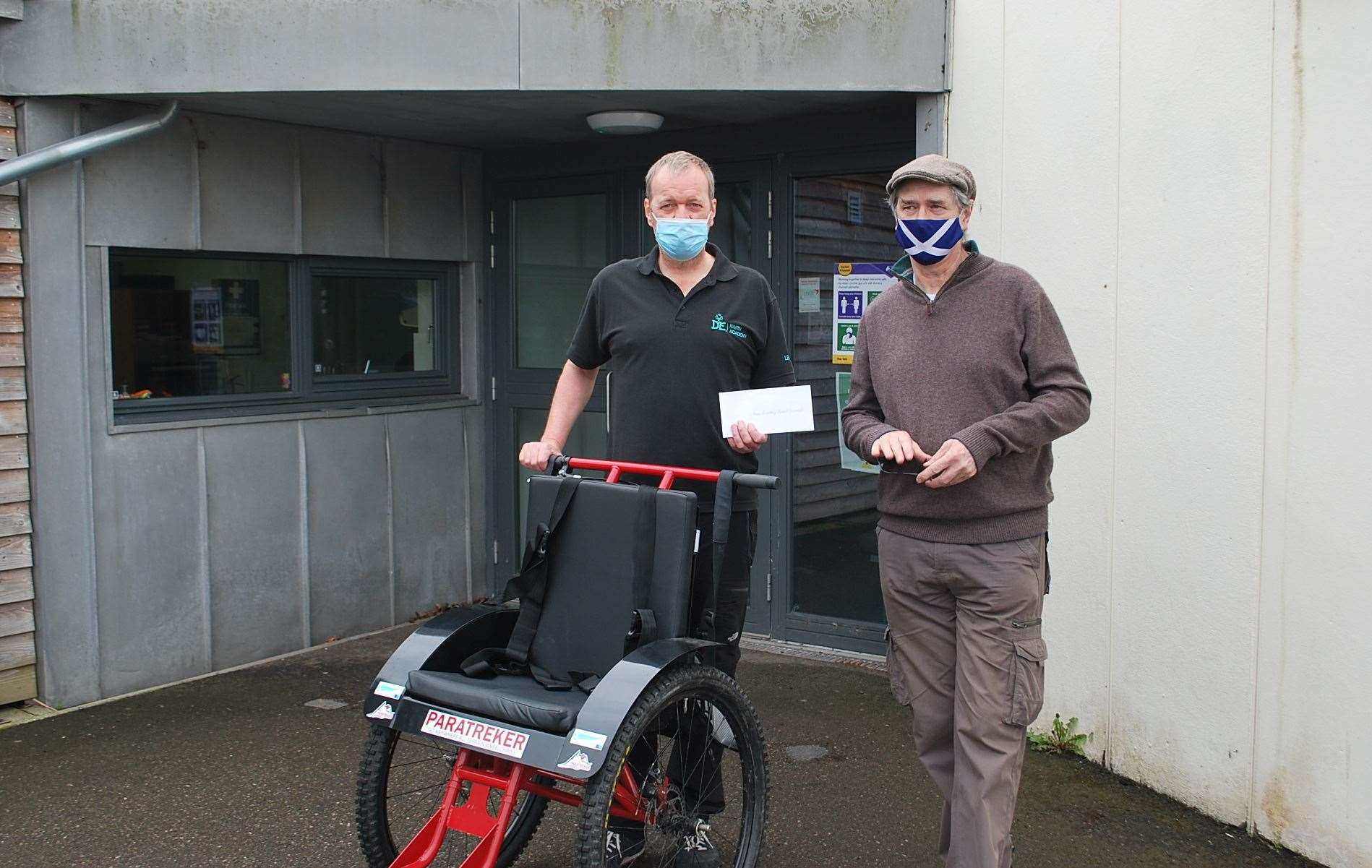 Duncan Sanderson and Hamish Bain with Nairn Academy’s new Paratreker wheelchair.