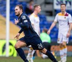 Martin Woods is back at Ross County after signing a two-year deal.