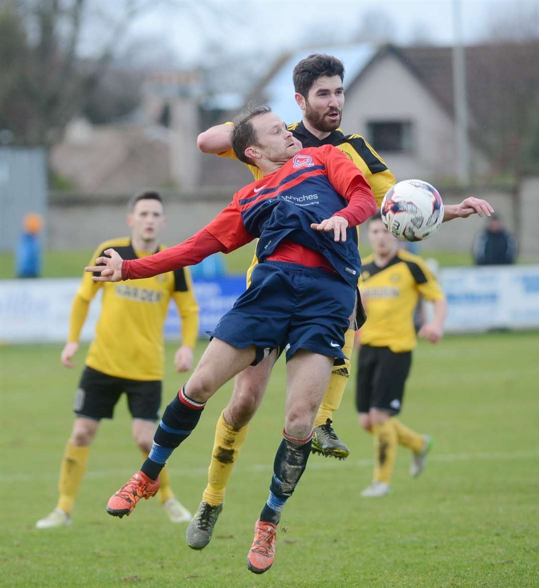 Callum Maclean (top) tussles with a Turriff United opponent. The experienced defender is relishing the season ahead.
