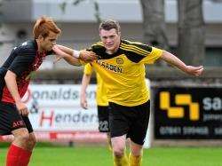 Wallace holds off Martin Laing against Inverurie on Saturday. Picture: Gary Anthony.