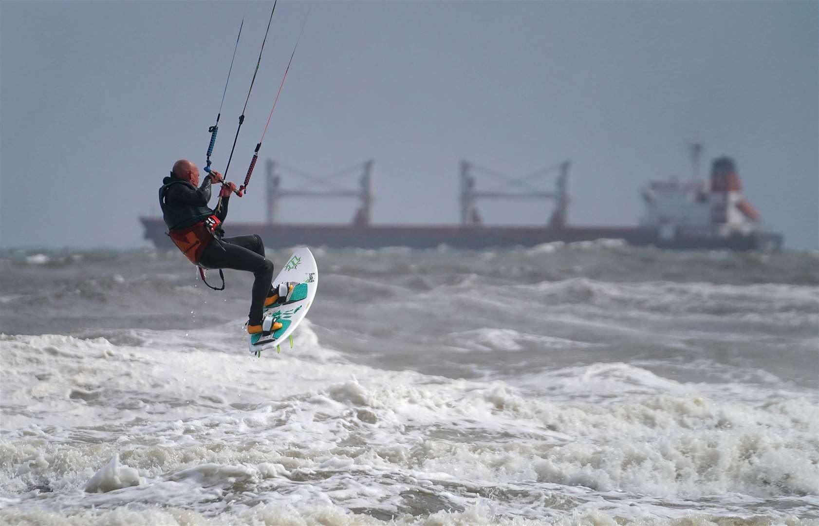 Kite surfers off Tynemouth beach in north-east England (Owen Humphreys/PA)