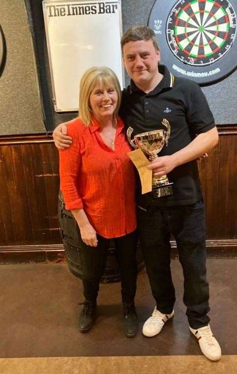Michael Maclean is pictured with Colette McPherson from the Innes Bar after winning the Boxing Day Cup.