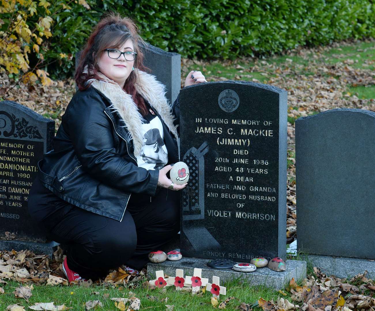 Kelly Anne Mackie at the grave of her grandfather James Mackie. Picture: Gary Anthony.
