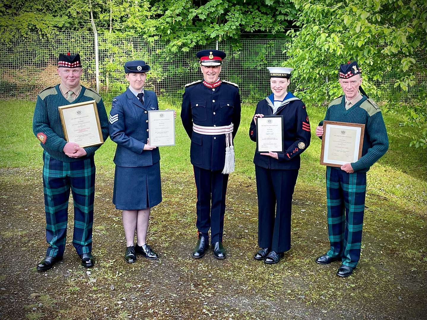 RSMI MacLeod (left) and Major Cassidy (right) with Certificates of Meritorious Service alongside Lord Lieutenant of Inverness-shire Mr James Wotherspoon