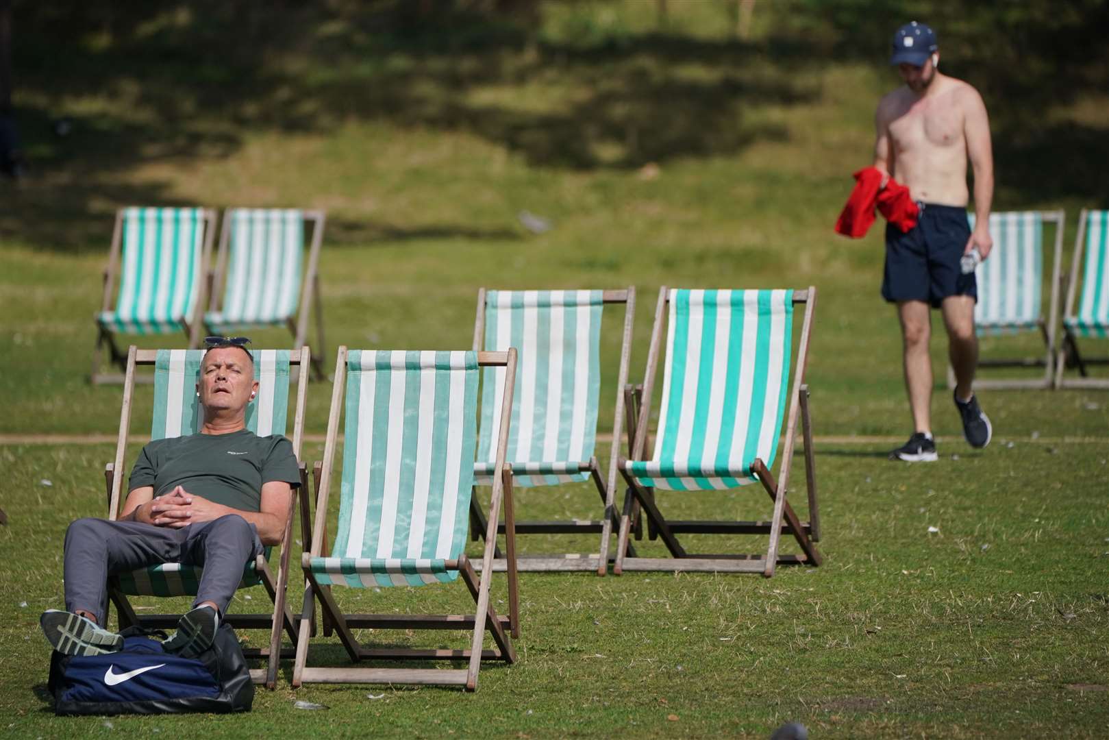 People enjoying the warm weather in Hyde Park in central London (Jonathan Brady/PA)