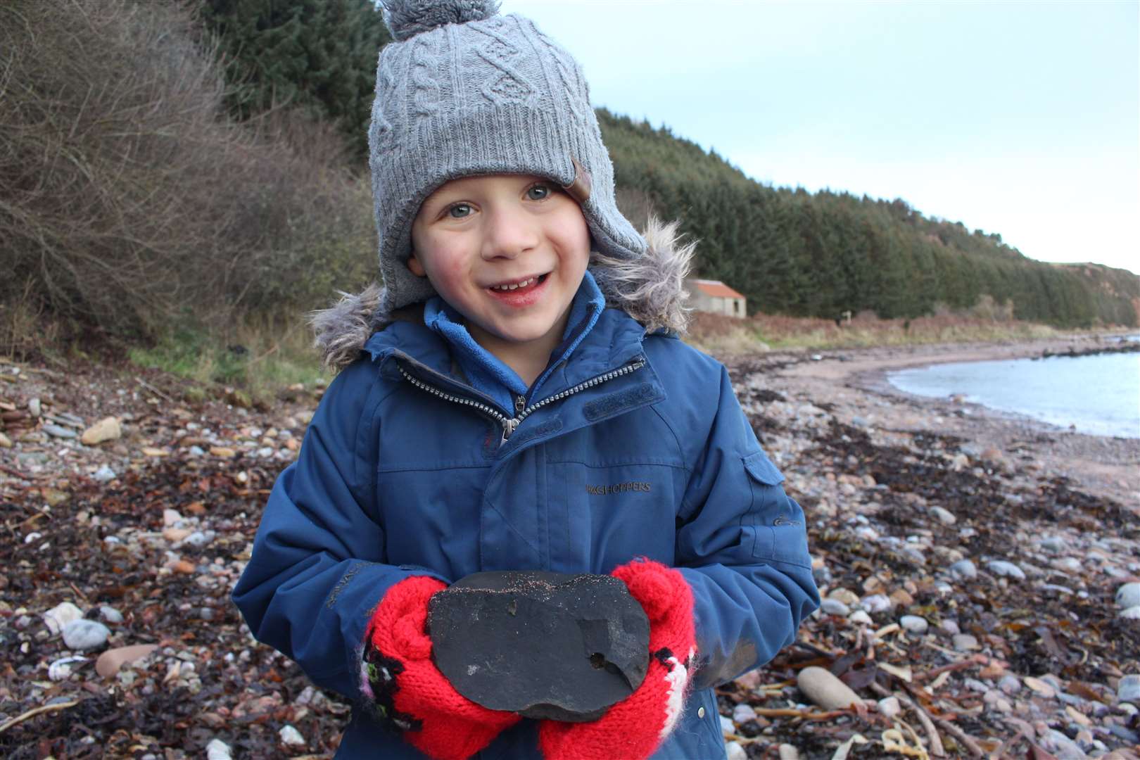 Matthew with his first fossil find.