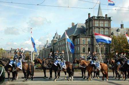 Part of the mounted escort wait before the parliament buildings to escort the royal party back to their palace in Den Haag