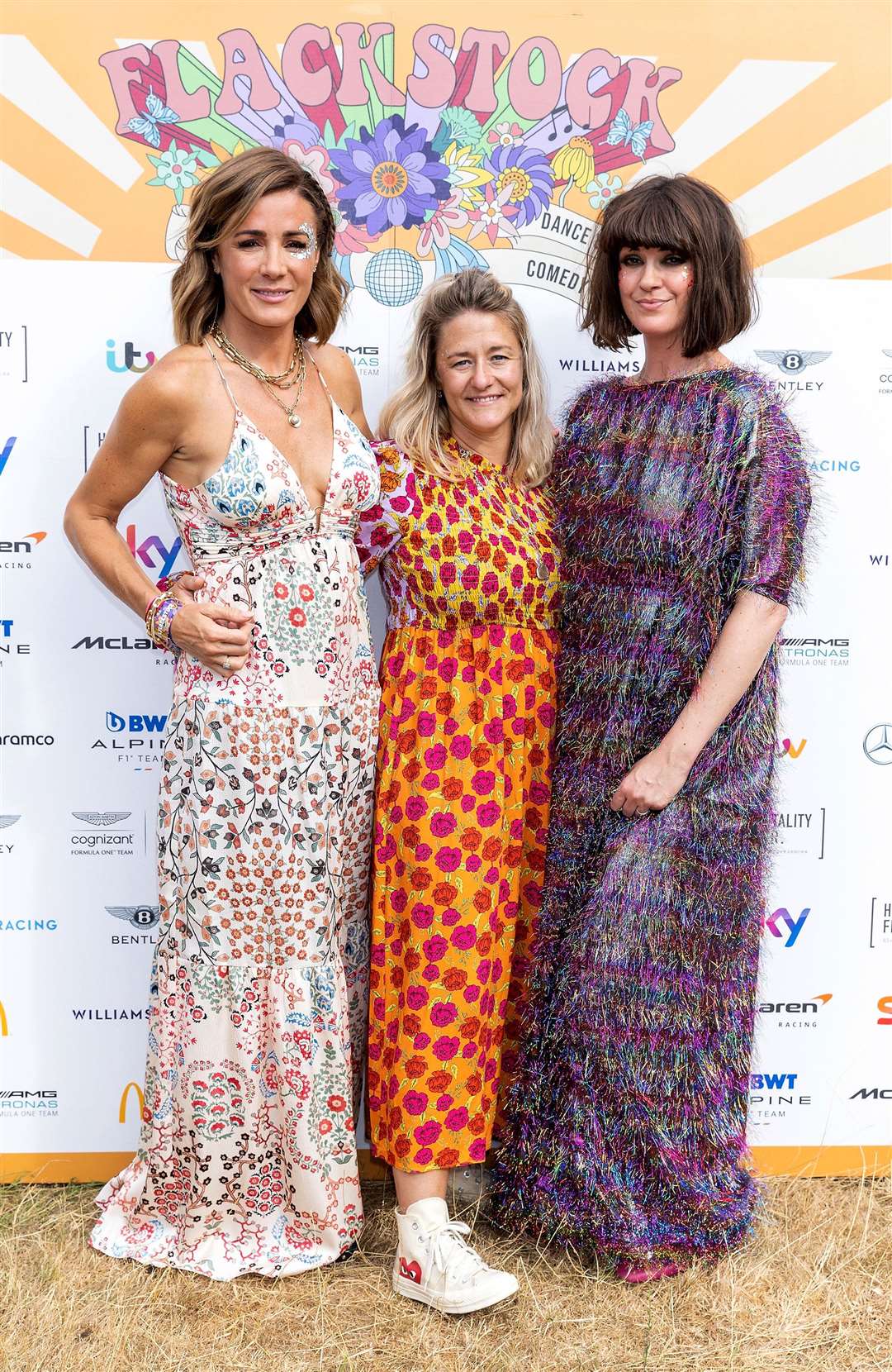 Natalie Pinkham (left) at the Flackstock festival with Caroline Flack’s twin sister Jody Flack (centre) and friend TV presenter Dawn O’Porter who is the festival’s co-founder (PA)