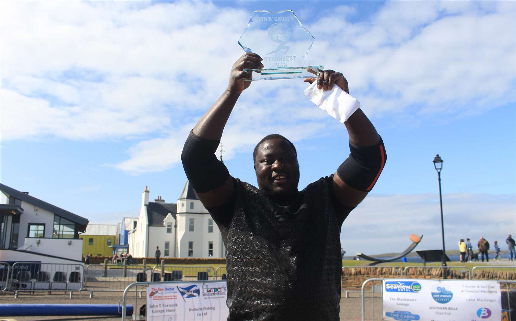 Zake Muluzi, the 'Malawian Monster', with his trophy after winning the John O'Groats Strongest Man competition on Sunday. Picture: Alan Hendry
