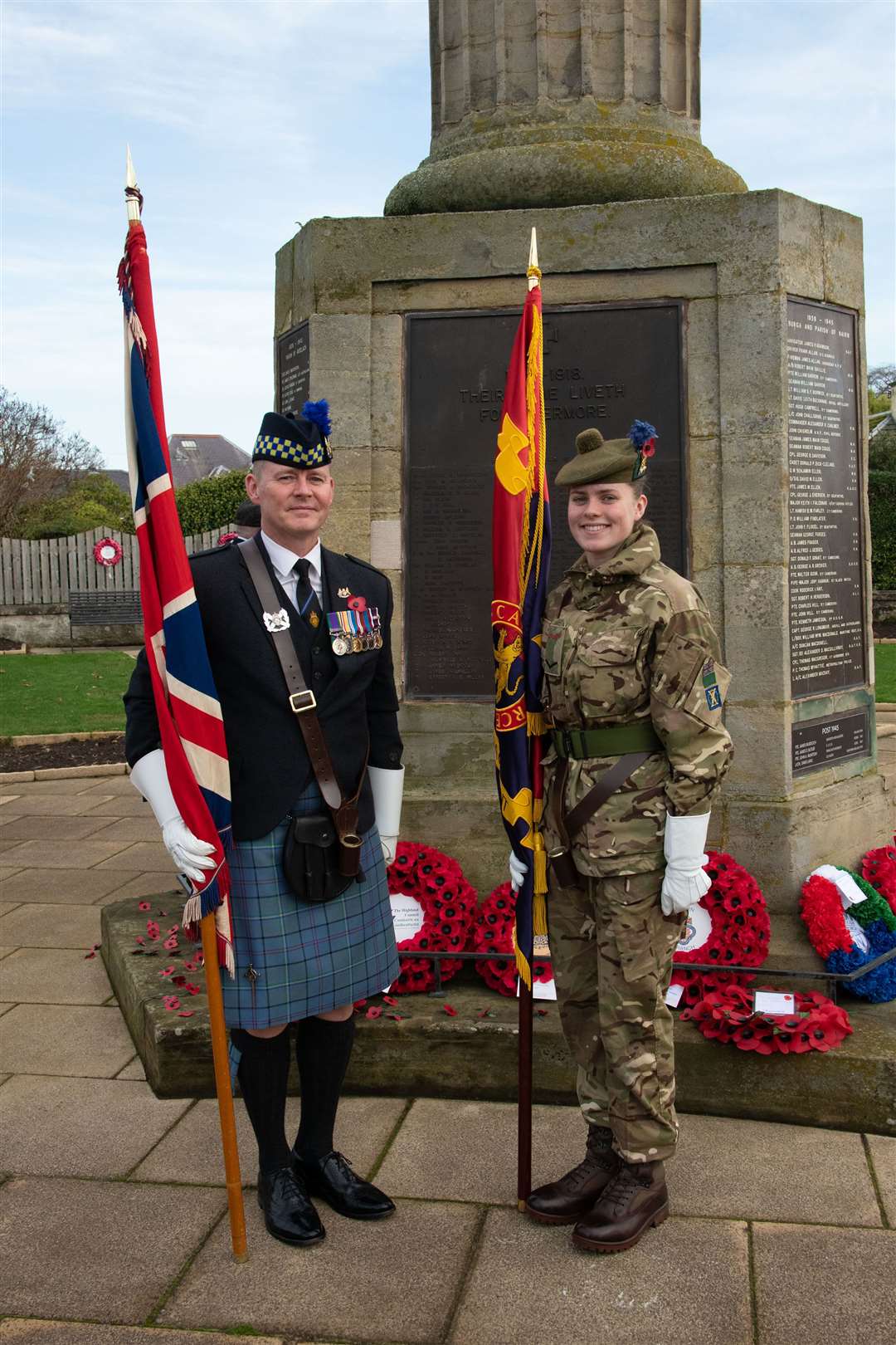 Father and daughter Dale and Darcey Woodman (15) who is an Army cadet on parade for the first time with the colours of the British Legion and the Army cadets in Nairn. Picture: Ian Macrae
