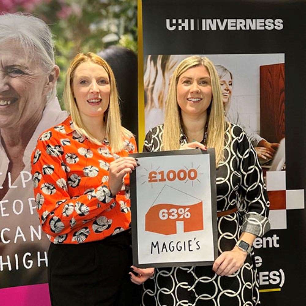 Tracey Gill of Maggie's Highlands accepts the £1000 donation from UHI Inverness vice principal Lindsay Snodgrass.