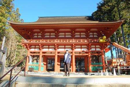 The entrance gates to Koyasan temple complex, with the author showing his official armband allowing photography
