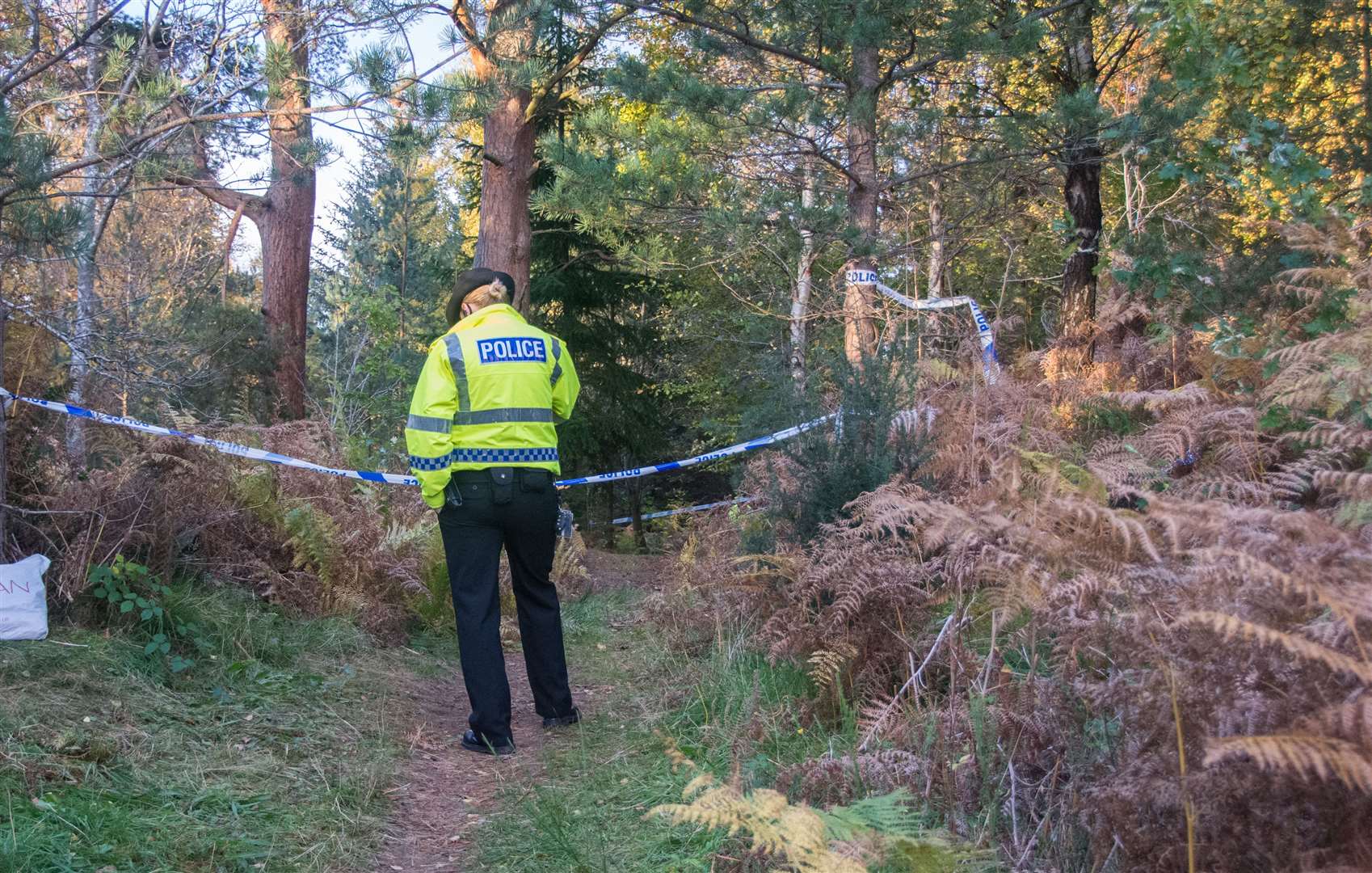 An officer close to the scene at Birkenhill Woods, Elgin.