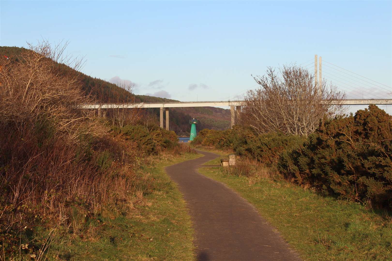 The winding path that leads to Carnarc Point, with the Kessock Bridge in view.