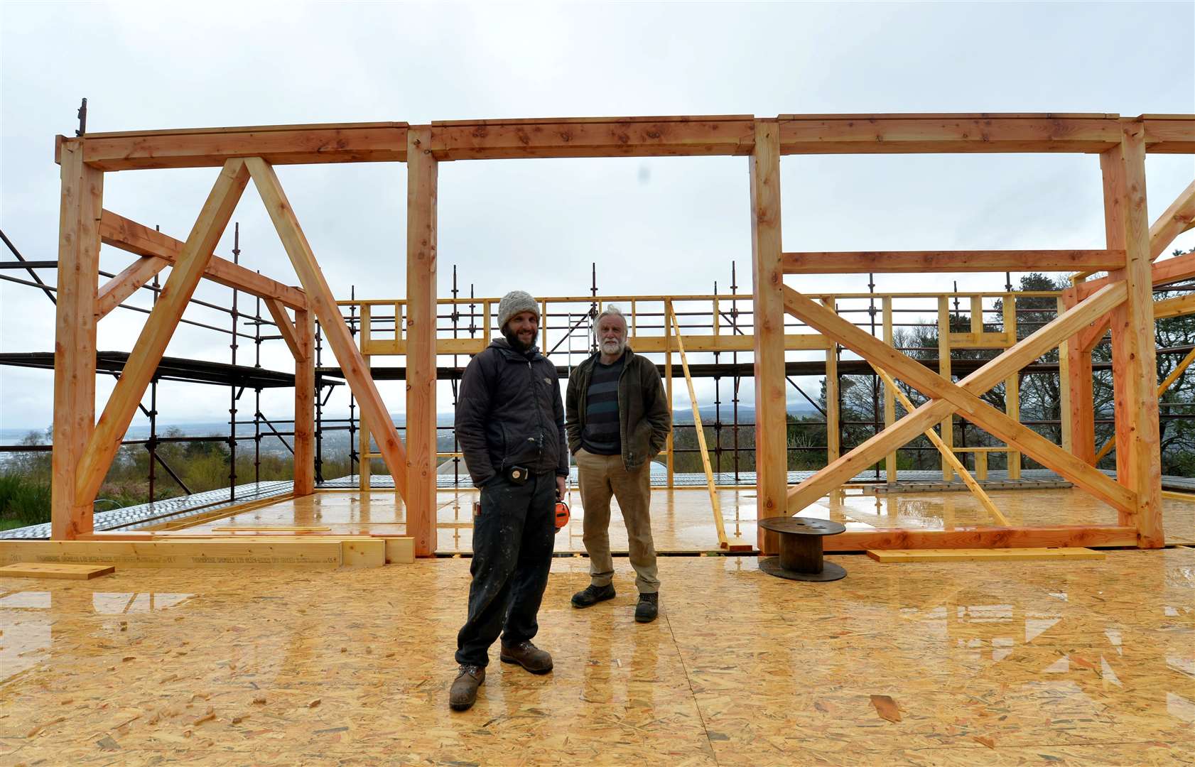 Gaspard Meric, front, who is building an eco house at Anam Cara in the Leachkin area of Inverness, with owner Alastair Cunningham. Picture: Callum Mackay