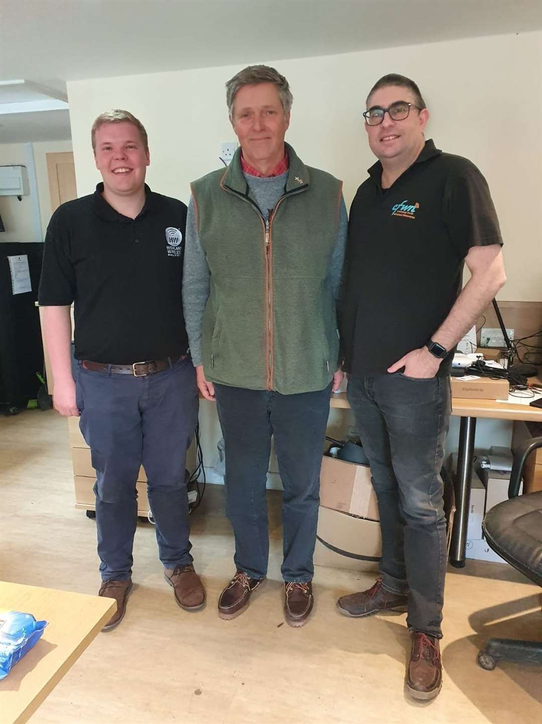 MSP Edward Mountain (centre) with Cameron Warren of Highland Wireless and Mike Hicks of Cromarty Firth Wireless Network.