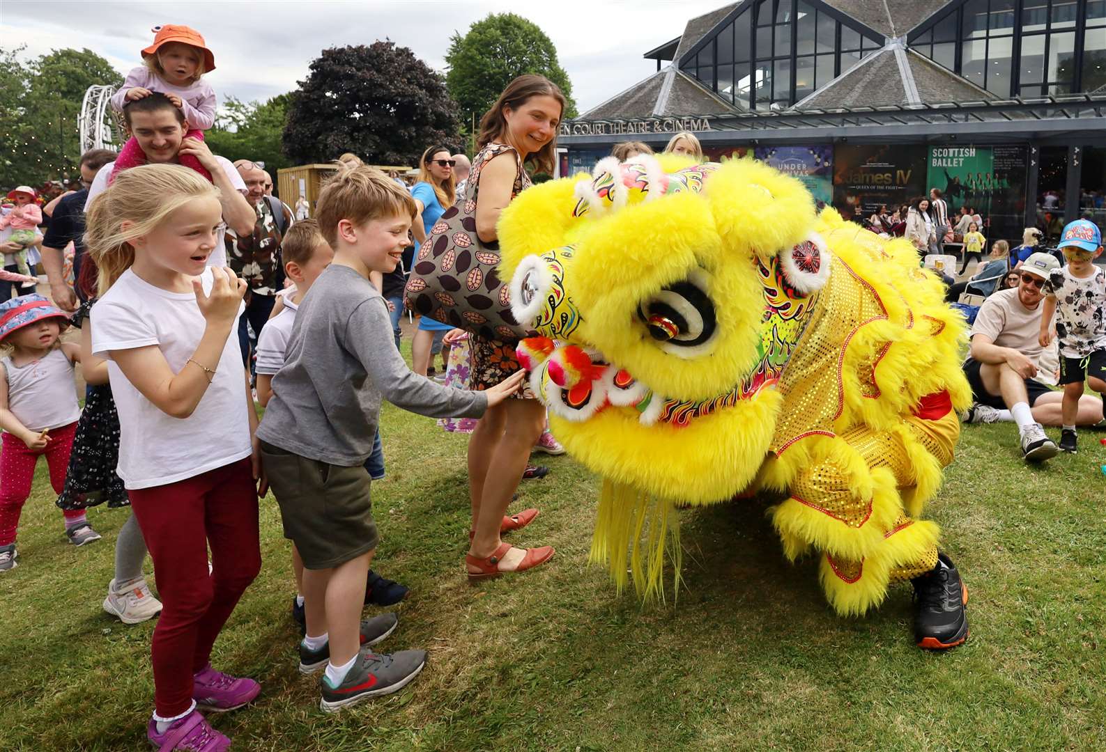 The children ran up to see Yee's Hung Ga Kung Fu-Lion and Dragon Dance's lion.