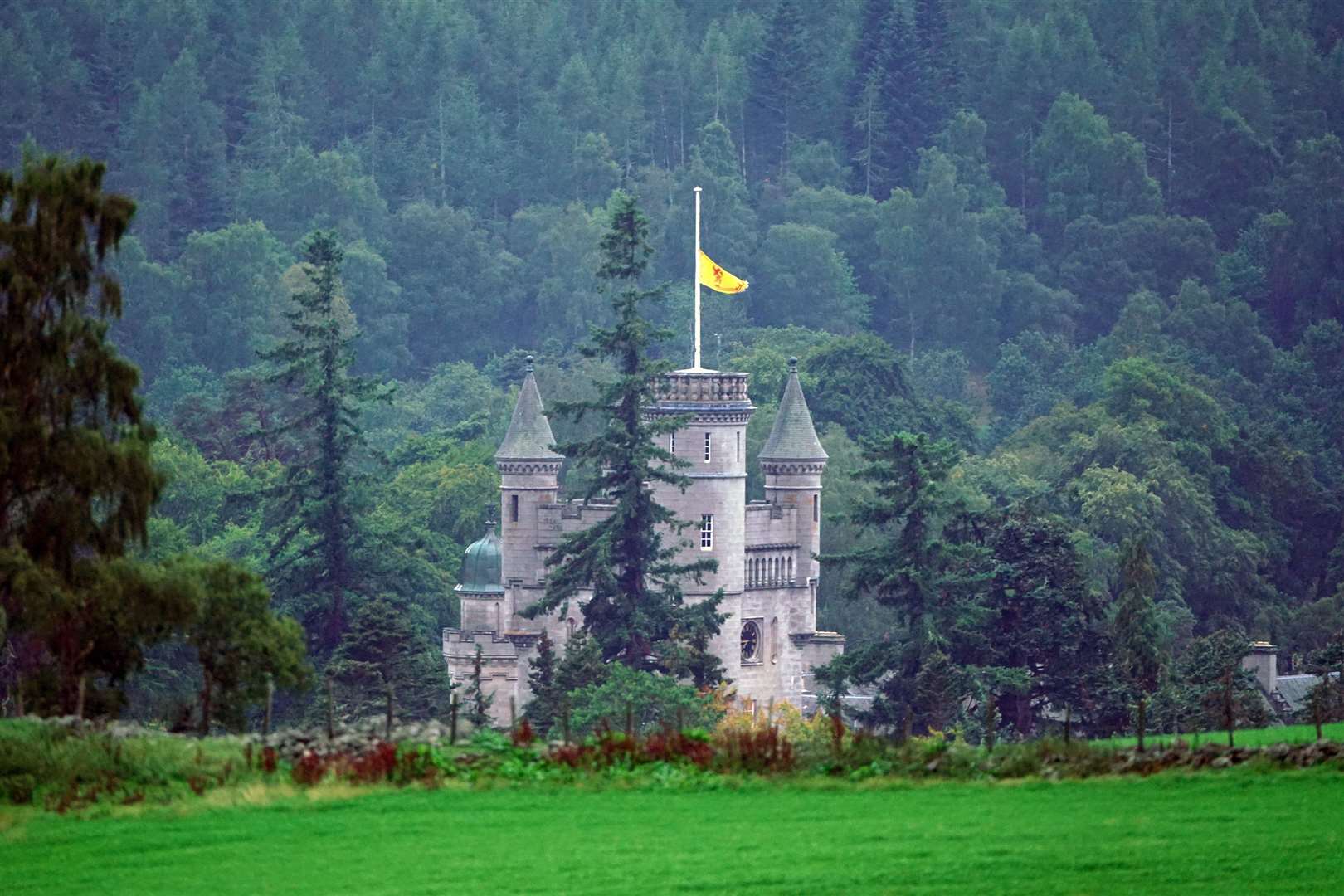 The Royal Banner of Scotland above Balmoral Castle flown at half mast following the announcement of the death of the late Queen (Owen Humphreys/PA)