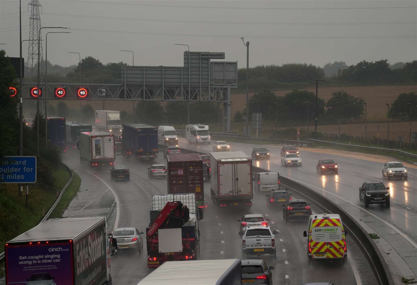 Slow traffic in heavy rain on the M62 near Brighouse in West Yorkshire (Danny Lawson/PA)